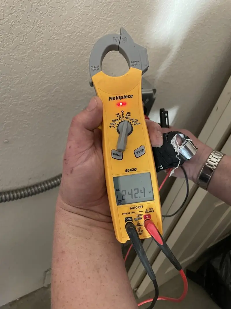 Voltage testing with clamp meter during Outlet Installation in Mundy
